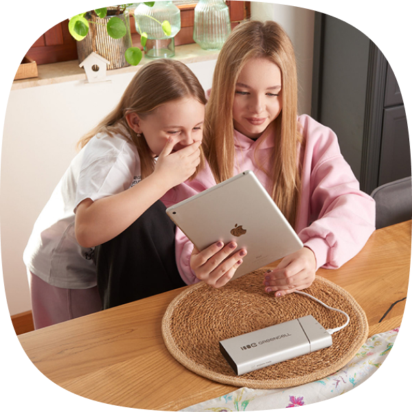 Photo of children charging a tablet using PowerPlay Pro