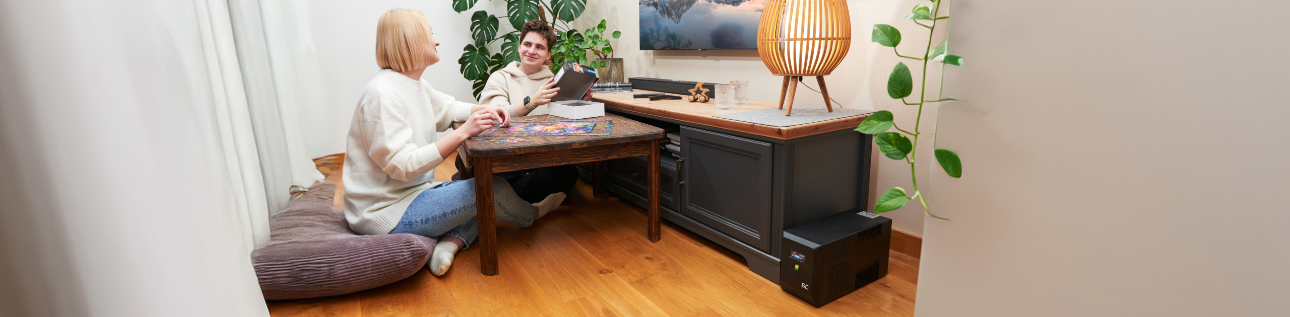 Image of people assembling puzzles, with UPS PowerProof in the background